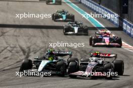 Lewis Hamilton (GBR) Mercedes AMG F1 W15 and Nico Hulkenberg (GER) Haas VF-24 battle for position. 05.05.2024. Formula 1 World Championship, Rd 6, Miami Grand Prix, Miami, Florida, USA, Race Day.