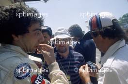 Michele Alboreto (ITA) Lancia Martini Racing talks with Cesare Fiorio and Gianni Tonti