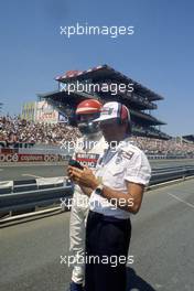 Eddie Cheever (USA) Lancia Martini Racing talks with Cesare Fiorio