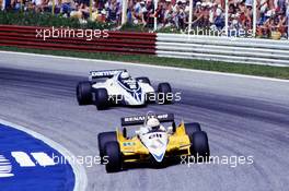 Rene Arnoux (FRA) Renault RE 30B leads Riccardo Patrese (ITS) Brabham BT50 Bmw