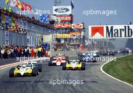 Alain Prost (FRA) Renault RE 30 B leads the group at start