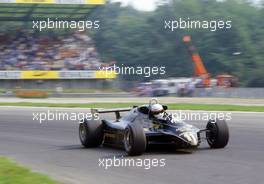 Elio de Angelis (ITA) Lotus 91 Ford Cosworth at Parabolica corner