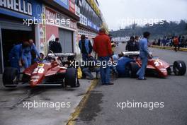 Didier Pironi (FRA) and Gilles Villeneuve (CDN) Ferrari 126 C2 in the pit lane