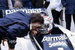 Nelson Piquet (BRA) Brabham BT50 Bmw talks with Bernie Ecclestone Brabham