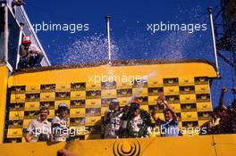 Riccardo Patrese (ITA) Brabham 1st position,Andrea de Cesaris (ITA) Alfa Romeo 2nd position,Nelson Piquet (BRA) Brabham 3rd position celebrates podium