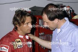 Rene'Arnoux (FRA) Ferrari talks with Marco Piccinini