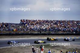 Nelson Piquet (BRA) Brabham BT52 BMW leads a group at Tarzan corner