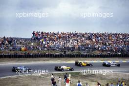 Nelson Piquet (BRA) Brabham BT52 BMW leads a group at Tarzan corner