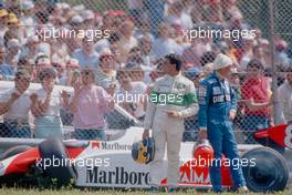 Michele Alboreto (ITA) Tyrrell and Niki Lauda (AUT) McLaren after thecrash at Acque Minerali