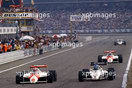 Niki Lauda (AUT) McLaren Mp41/C Ford Cosworth battles with Keke Rosberg (FIN) Williams FW 08C Ford Cosworth