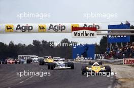 Alain Prost (FRA) Renault RE40 1st position leads Riccardo Patrese (ITA) Brabham BT52 BMW