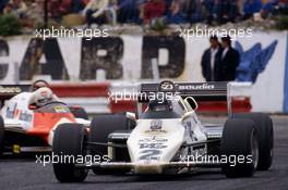 Jacques Laffite (FRA) Williams FW 08C Ford Cosworth leads Andrea de Cesaris (ITA) Alfa Romeo 183T