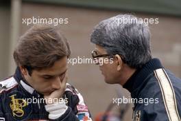 Elio de Angelis (ITA) Lotus talks with Peter Warr