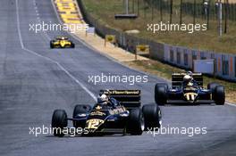 Nigel Mansell (GBR) Lotus 94T Renault leads teammate Elio de Angelis (ITA)