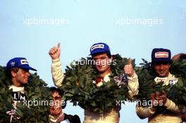 Pierluigi Martini (ITA) Minardi M283 Bmw Minardi Team 2nd position celebrate on podium with Roberto del Castello (ITA) March Bmw 3rd position and Jonathan Palmer (GBR) Ralt Honda 1st position