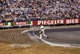 Michele Alboreto (ITA) Tyrrell cross the track after the race default