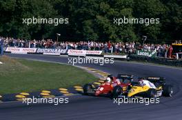 Rene'Arnoux (FRA) Ferrari 126 C3 battles with Eddie Cheever (USA) Renault RE 40 at Druids corner