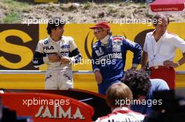 Nelson Piquet (BRA) Brabham talks with Niki Lauda (AUT) and Ron Dennis McLaren