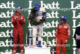 Nelson Piquet (BRA) Brabham 1st position Niki Lauda (AUT) McLaren 2st position Alain Prost (FRA) McLaren 3rd position celebrates podium