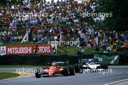 Michele Alboreto (ITA) Ferrari 126 C4 lead Teo Fabi (ITA) Brabham BT 53 Bmw