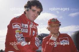 Alain Prost (FRA) McLaren talks with Niki Lauda (AUT) McLaren