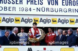 Alain Prost (FRA) McLaren 1st position Nelson Piquet (BRA) Brabham 2nd position Michele Alboreto (ITA) Ferrari celebrate podium