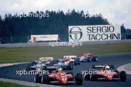 Michele Alboreto (ITA) Ferrari 126 C4 2nd position battles with teammate Rene Arnoux (FRA)
