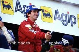 Alain Prost (FRA) McLaren 1st position Michele Alboreto (ITA) Ferrari 2nd position celebrates podium