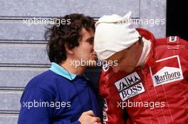 Alain Prost (FRA) talks with teammate Niki Lauda (AUT) McLaren