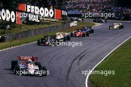 Andrea de Cesaris (ITA) Ligier JS23 Renault leads a group