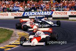 Alain Prost (FRA) McLaren Mp4/2 Tag Porsche leads teammate Niki Lauda (AUT) 1st position and Nelson Piquet (BRA) Brabham BT 53 Bmw