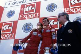Niki Lauda (AUT) McLaren 2nd position and World Trichampion Alain Prost (FRA) McLaren 1st position Jean Marie Balestre Fia and FFSA president