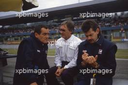Bernie Ecclestone talks with Paul Rosche Bmw and Gordon Murray Brabham