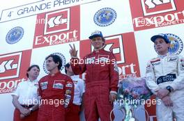 Niki Lauda (AUT) McLaren  2nd position and World Trichampion Alain Prost (FRA) McLaren 1st position  Ayrton Senna da Silva(BRA) Toleman 3rd position and John Barnard celebrates podium