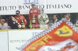 Niki Lauda (AUT) McLaren 1st position Michele Alboreto (ITA) Ferrari 2nd position Riccardo Patrese (ITA) 3rd position Alfa Romeo 3rd position celebrates podium