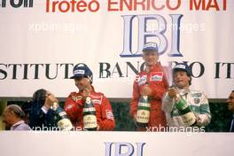 Niki Lauda (AUT) McLaren 1st position Michele Alboreto (ITA) Ferrari 2nd position Riccardo Patrese (ITA) 3rd position Alfa Romeo 3rd position celebrates podium