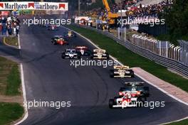 Niki Lauda (AUT) McLaren Mp4/2 Tag Porsche 2nd position leads a group