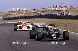 Nigel Mansell (GBR) Lotus 95T Renault 3rd position leads Alain Prost (FRA) McLaren Mp4/2 Tag Porsche 1st position
