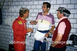 Rene Arnoux (FRA) Ferrari talks with Mauro Forghieri and Antonio Tomaini