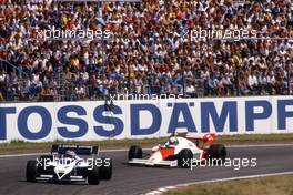 Nelson Piquet (BRA) Brabham BT 53 Bmw lead Alain Prost (FRA) McLaren MP4/2 TAG Porsche 1st position at Sachs Kurve