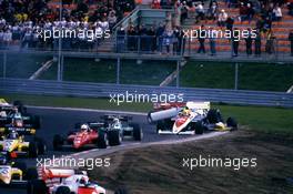 Ayrton Senna da Silva (BRA) Toleman TG 184 Hart crashes into Keke Rosberg (FIN) Williams Fw09B Honda