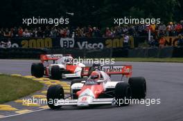Niki Lauda (AUT) McLaren Mp4/2 Tag Porsche 1st position leads teammate Alain Prost (FRA)
