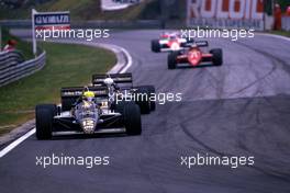 Ayrton Senna da Silva (BRA) leads teammate  Elio de Angelis (ITA) 1st position