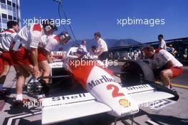 Alain Prost (FRA) McLaren MP4/2B Tag Porsche 1st position talks with John Bernard during pitstop