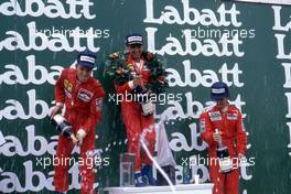 Stefan Johansson (SWE) Ferrari 2nd position Michele Alboreto (ITA) Ferrari 1st position Alain Prost (FRA) McLaren 3rd position celebrates podium