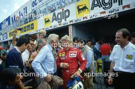 Gianni Agnelli talks with Stefan Johansson (SWE) Ferrari and Marco Piccinini