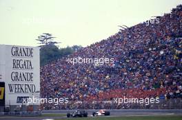 Elio de Angelis (ITA) Lotus 97T Renault 1st position leads Niki Lauda (AUT) McLaren MP4/2B Tag Porsche
