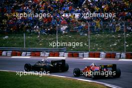 Elio de Angelis (ITA) Lotus 97T Renault 1st position battles with Stefan Johansson (SWE) Ferrari 156/85