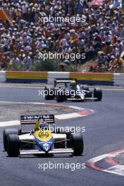 Keke Rosberg (FIN) Willams FW10 Honda 2nd position leads Ayrton Senna da Silva (BRA) Lotus 97T Renault