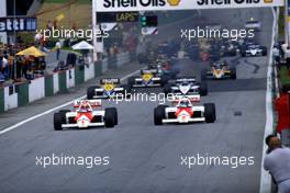 Niki Lauda (AUT) McLaren MP4/2B Tag Porsche leads teammate Alain Prost (FRA) 1st position at start